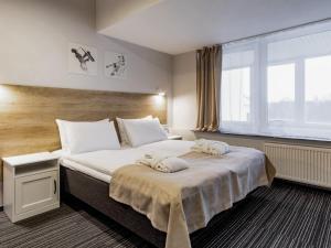Postel nebo postele na pokoji v ubytování PARK HOTEL VILNIUS
