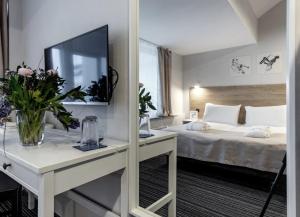 Postel nebo postele na pokoji v ubytování PARK HOTEL VILNIUS