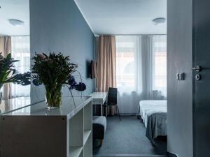 Postel nebo postele na pokoji v ubytování PARK HOTEL VILNIUS