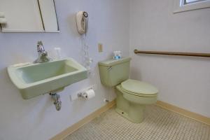a bathroom with a toilet and a sink at Sahara Motel in Ocean City