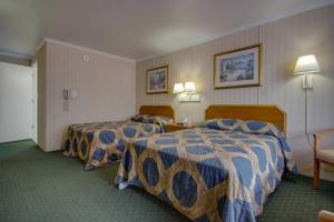 a hotel room with two beds in a room at Sahara Motel in Ocean City