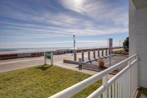 a balcony with a white fence and the beach at Sahara Motel in Ocean City