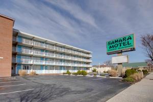 a building with a sign in a parking lot at Sahara Motel in Ocean City