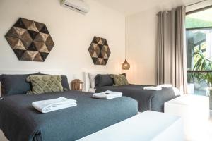 Katil atau katil-katil dalam bilik di Casa Pibe, Private jacuzzi, Pier and Rooftop +15 gambar