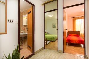 Postel nebo postele na pokoji v ubytování Sisplac Apartment