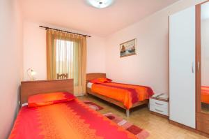 Postel nebo postele na pokoji v ubytování Sisplac Apartment
