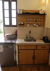 a kitchen with a sink and a counter top at Olala house in Sucre