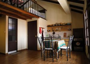 a dining room with a table and chairs at Olala house in Sucre