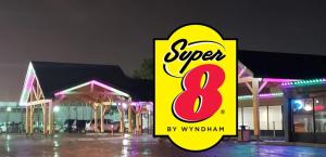 a sign that reads super in front of a building at Super 8 by Wyndham Spruce Grove in Spruce Grove