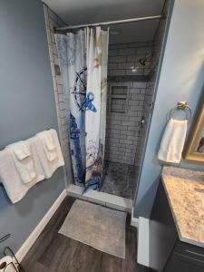 a bathroom with a shower with a shower curtain at Paradise on Lake Harris Apt #202 in Leesburg
