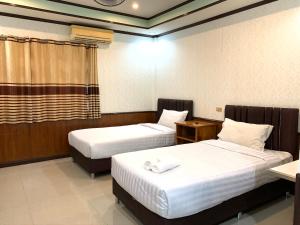 Postel nebo postele na pokoji v ubytování Suanpai Resort Sattahip