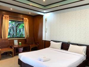Postel nebo postele na pokoji v ubytování Suanpai Resort Sattahip