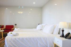 Postel nebo postele na pokoji v ubytování Omirita Resort Dalat