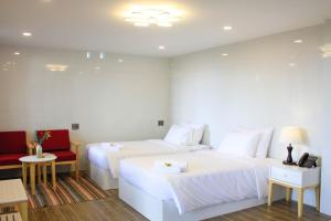 Postel nebo postele na pokoji v ubytování Omirita Resort Dalat