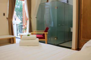Postel nebo postele na pokoji v ubytování Omirita Resort Dalat