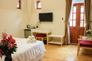 TV a/nebo společenská místnost v ubytování Omirita Resort Dalat