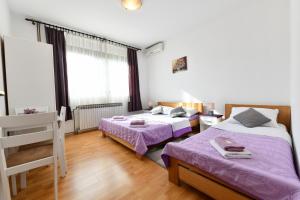 a bedroom with two beds and a ladder in it at Apartments and rooms with parking space Rakovica, Plitvice - 20647 in Rakovica