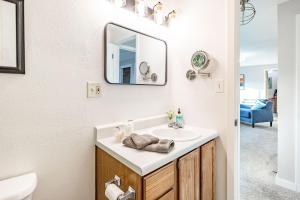 a bathroom with a sink and a mirror at THE SHORELINE- Beach Access, Ocean Views, Private in Kodiak