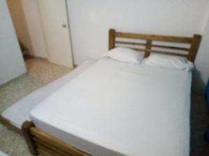 Ein Bett oder Betten in einem Zimmer der Unterkunft Apartamento tipo duplex