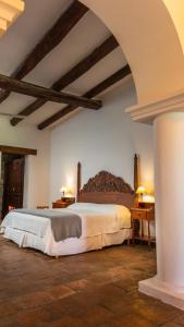 a bedroom with a large bed in a room at Finca El Recreo in Cafayate