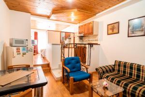 a living room with a couch and a table at 100 Wonderful House in Bogotá
