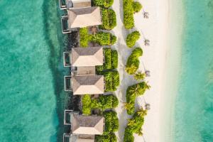 an aerial view of the beach and the ocean at Intercontinental Maldives Maamunagau Resort with Club benefits - IHG Hotel in Raa Atoll