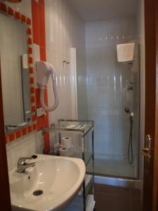 a bathroom with a sink and a shower at Residencia Real del Castillo de Curiel in Curiel de Duero