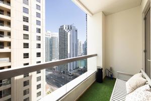a balcony with a view of a city at JBR Beach Hostel - Pool - Walk To JBR Beach - Metro Station in Dubai