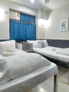 Postelja oz. postelje v sobi nastanitve Apple Hostel 蘋果賓館