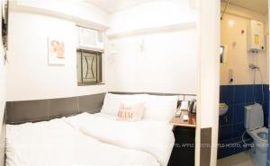 Postelja oz. postelje v sobi nastanitve Apple Hostel 蘋果賓館