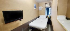 TV in/ali zabaviščno središče v nastanitvi Apple Hostel 蘋果賓館