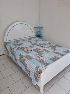 Кровать или кровати в номере Accueil Créole