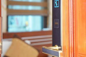 a close up of a door with a sign on it at TiGon Hotel in Ha Long