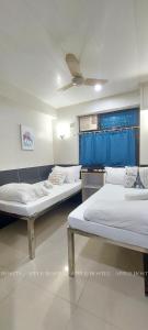 Postelja oz. postelje v sobi nastanitve Apple Hostel 蘋果賓館