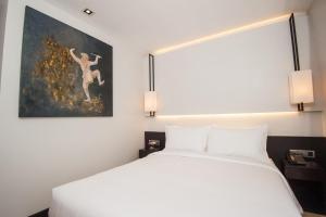Katil atau katil-katil dalam bilik di GLOW PARK HOTEL Grand Royal Palace
