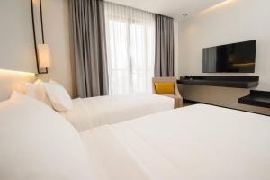 Katil atau katil-katil dalam bilik di GLOW PARK HOTEL Grand Royal Palace