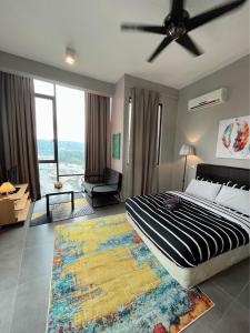 a bedroom with a large bed and a rug at Homey Studio Empire Damansara FreeWiFi Netflix in Petaling Jaya