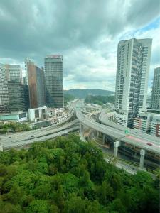 a view of a city with a highway and buildings at Homey Studio Empire Damansara FreeWiFi Netflix in Petaling Jaya