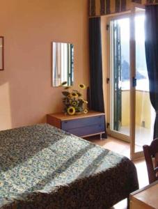 Postel nebo postele na pokoji v ubytování Hotel Miramare