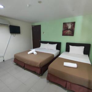 Postel nebo postele na pokoji v ubytování Best One Hotel