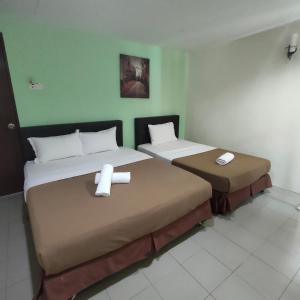 Postel nebo postele na pokoji v ubytování Best One Hotel