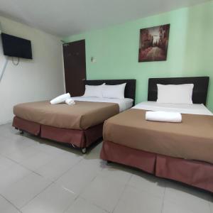 Postel nebo postele na pokoji v ubytování Best One Hotel