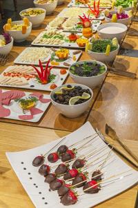 a table topped with lots of different types of food at Misafir Suites 8 Istanbul in Istanbul