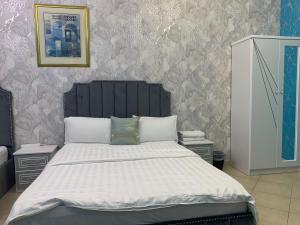 Postel nebo postele na pokoji v ubytování Jin Jie Residence