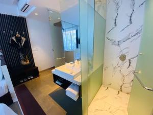 a bathroom with a sink and a mirror at UTEY Hotel in Siem Reap