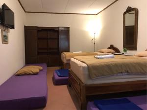 Кровать или кровати в номере Griya Lathifah Homestay