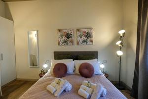 Postel nebo postele na pokoji v ubytování Verona Suites and Rooms