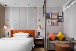 Letto o letti in una camera di Home2 Suites by Hilton Chongqing Yubei