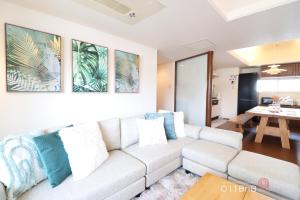 a living room with a couch and a table at NK BLD6F Sapporo 3LDK 3BR 1 floor 1 room in Sapporo