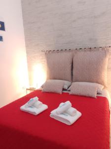 Postel nebo postele na pokoji v ubytování O'Paisi Casa Vacanze
